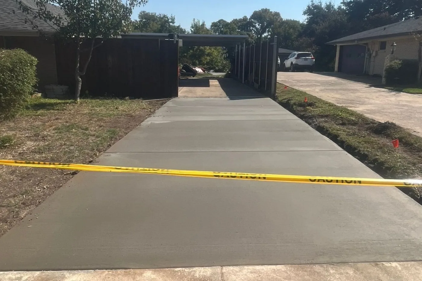 Finished wide residential concrete driveway by Lucky's Concrete
